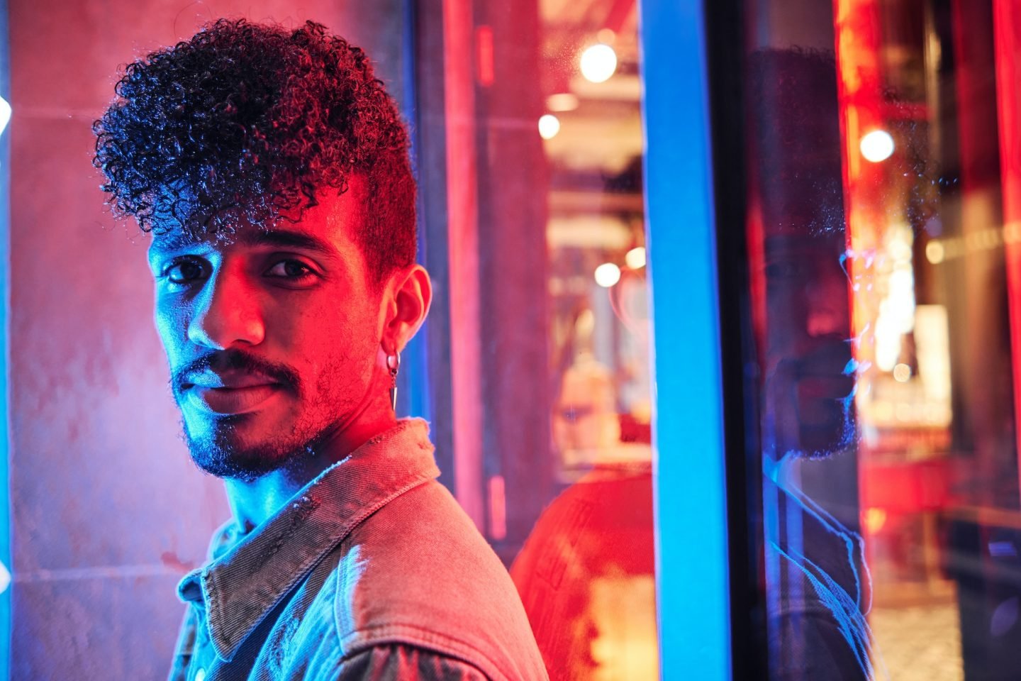 young-hispanic-man-close-to-a-neon-light-with-blue-and-red-lights-e1698314047406.jpg young-hispanic-man-close-to-a-neon-light-with-blue-and-red-lights-e1698314047406.jpg